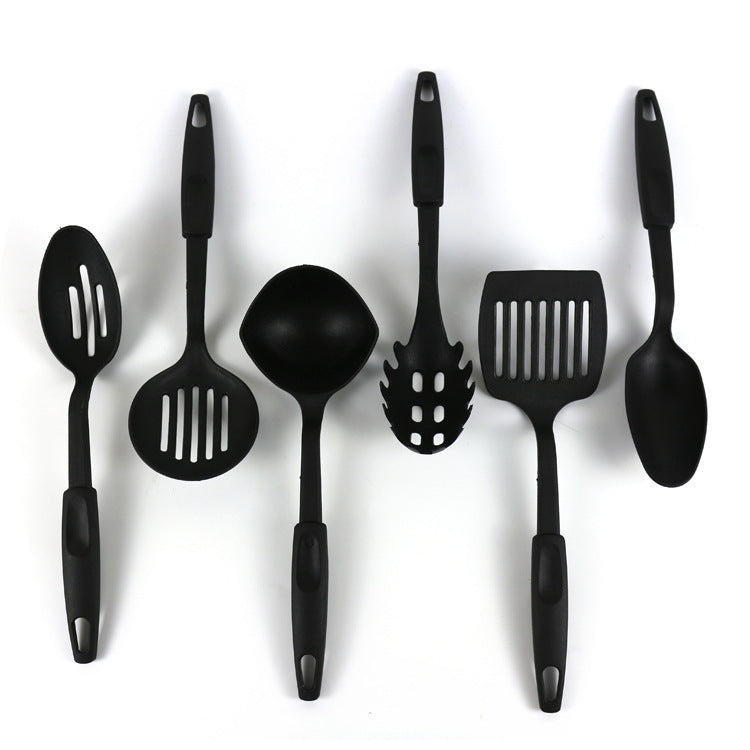 Set of black kitchen utensils on a white background