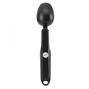 Black measuring spoon on a white background