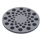 Round gray mat with black circular patterns on a white background