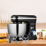 Black and silver stand mixer with attachments on a kitchen counter