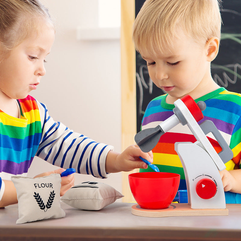 Kids Wooden Kitchen Toy Set with Cooking Pots and Appliances”.Two children playing with a toy kitchen set in a classroom setting.