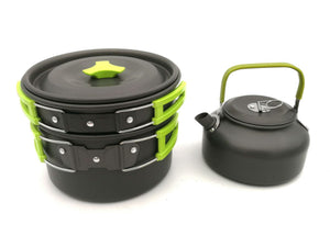 Black and green camping cookware set on a white background